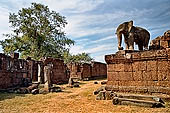 Angkor - Eastern Mebon - monolithic elephants at the corners of the platforms of the pyramid